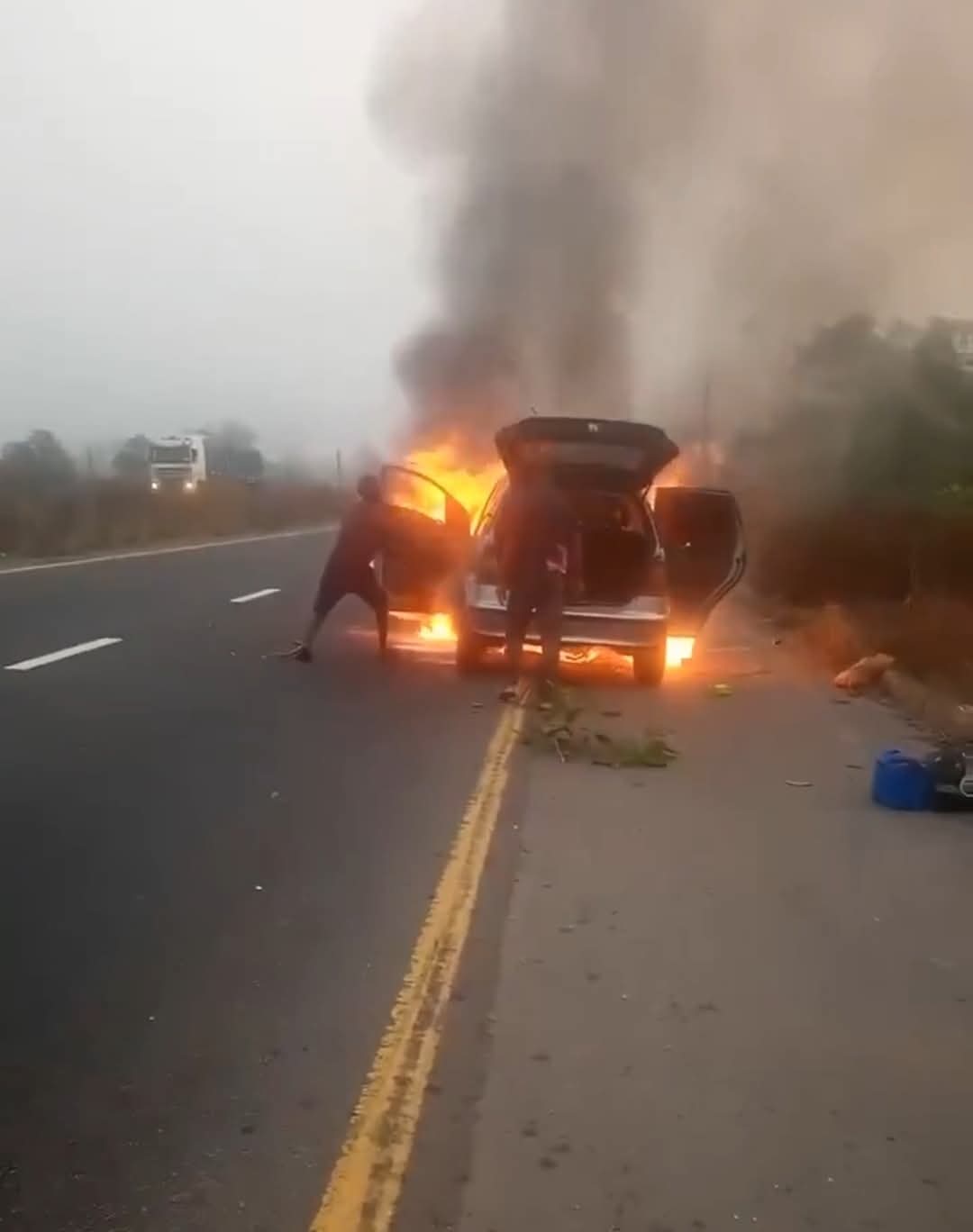 Sad: Woman  cries out as fire gutted their newly acquired car.